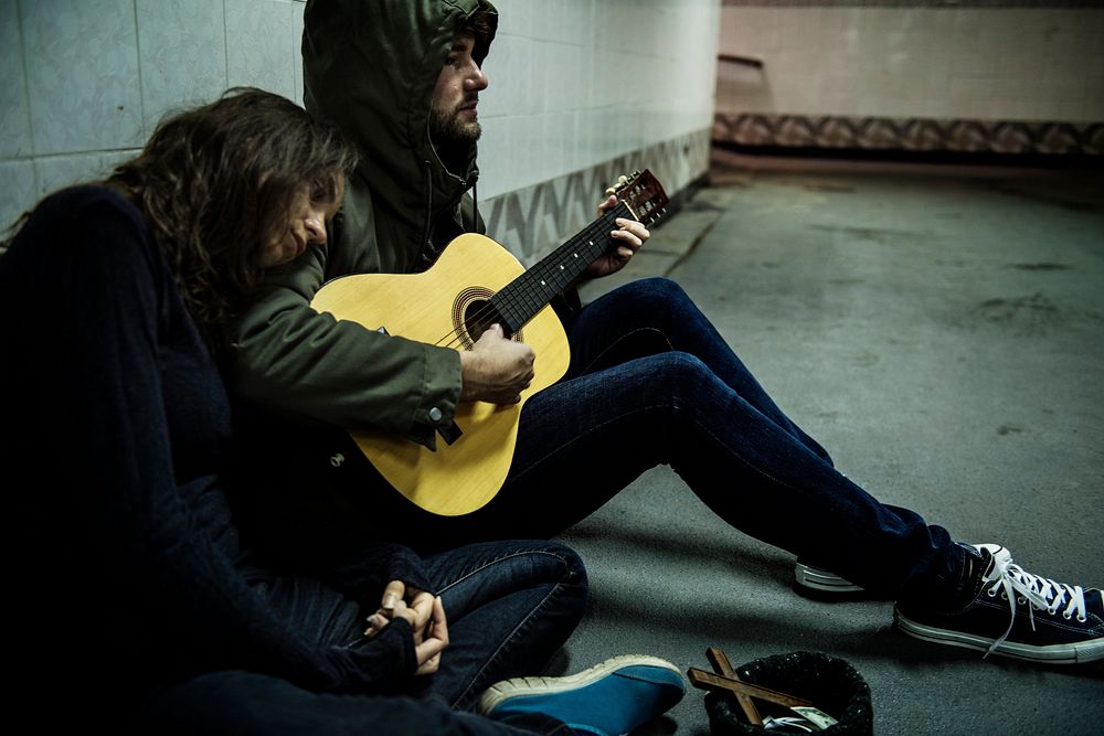 Homeless Couple  Playing Guitar Asking For Money Donation