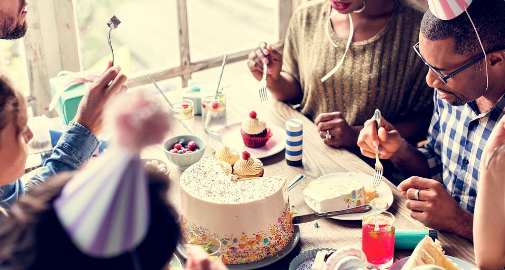 People celebrate birthday party with cake