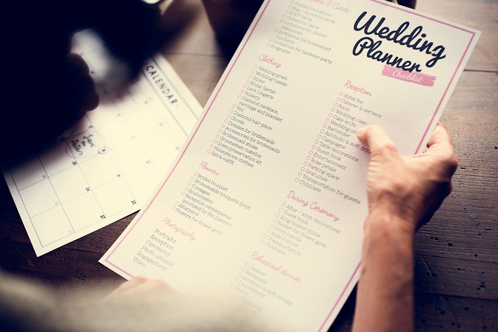 Hands Holding Wedding Planner Checklist Information Preparation
