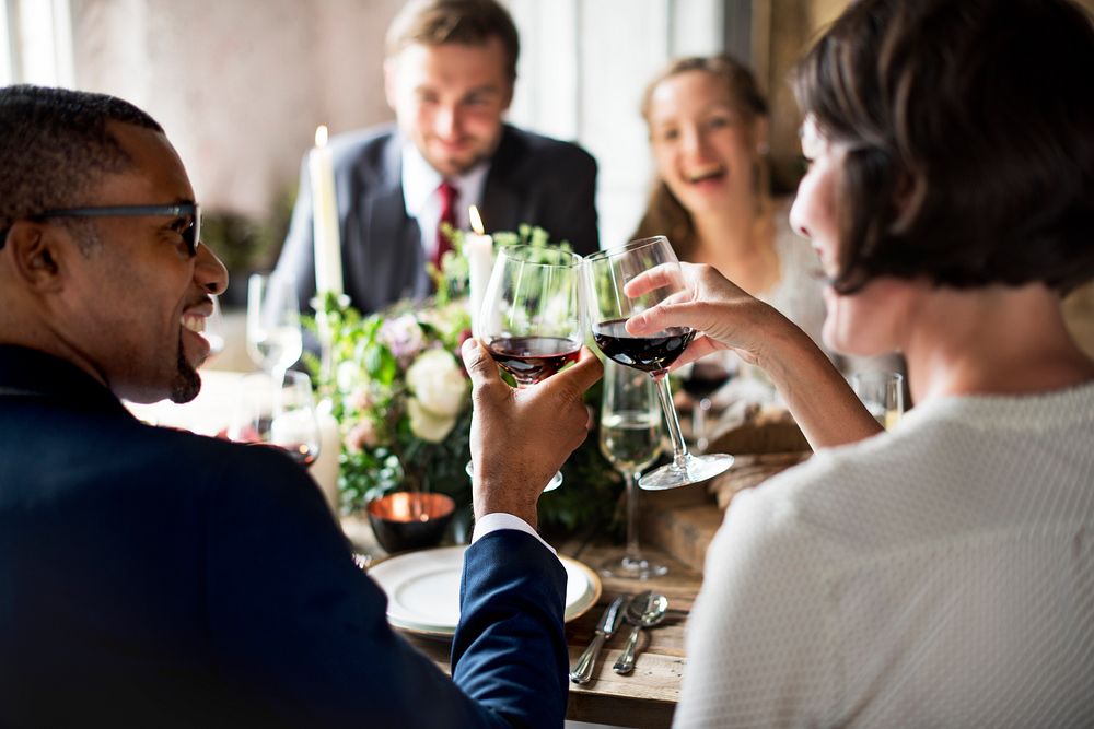 People doing a toast at the table