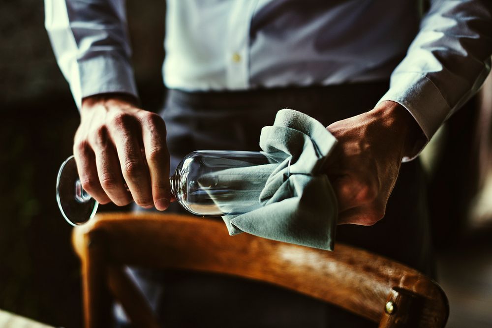 Restaurant Staff Wiping Glass on Table Setting Service for Reception