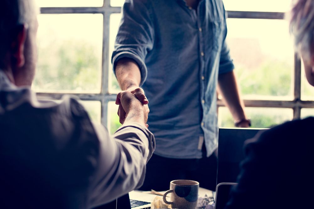 Business people agreement handshake together