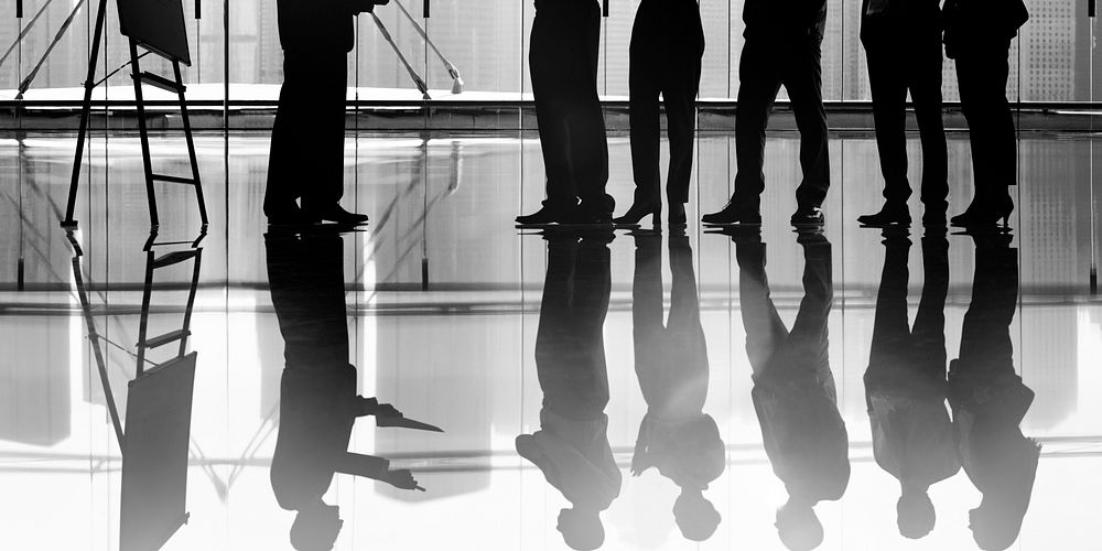 Silhouetted group of business people