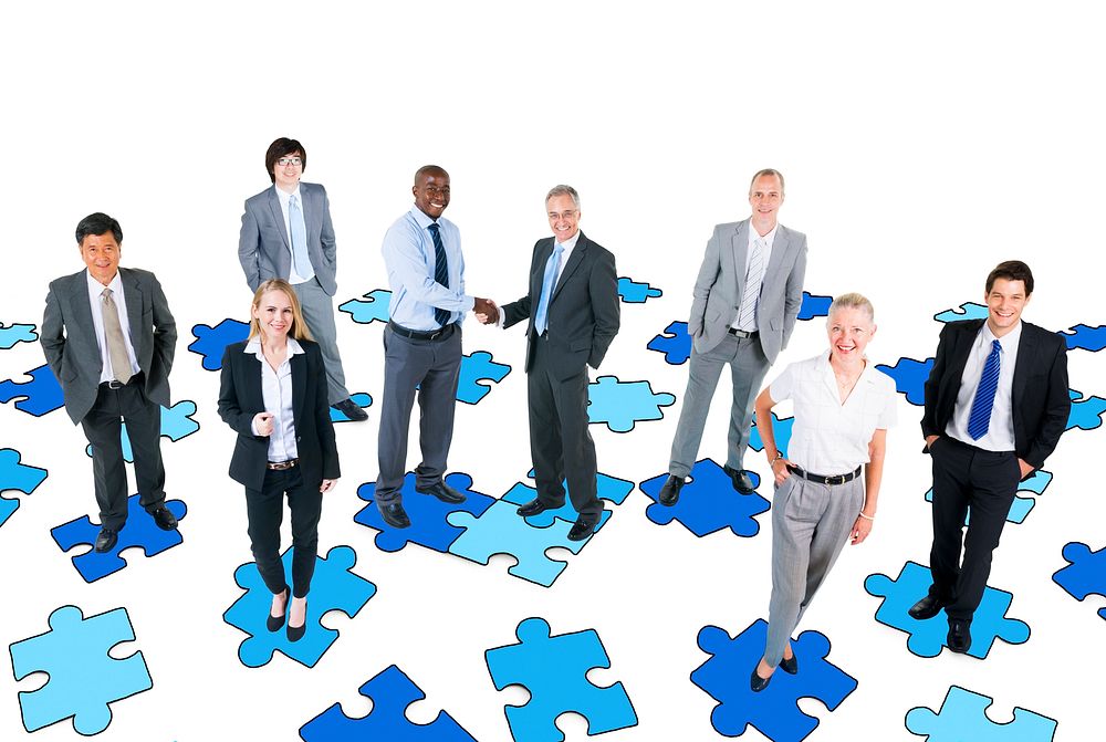 Group of Business People with Jigsaw Puzzle