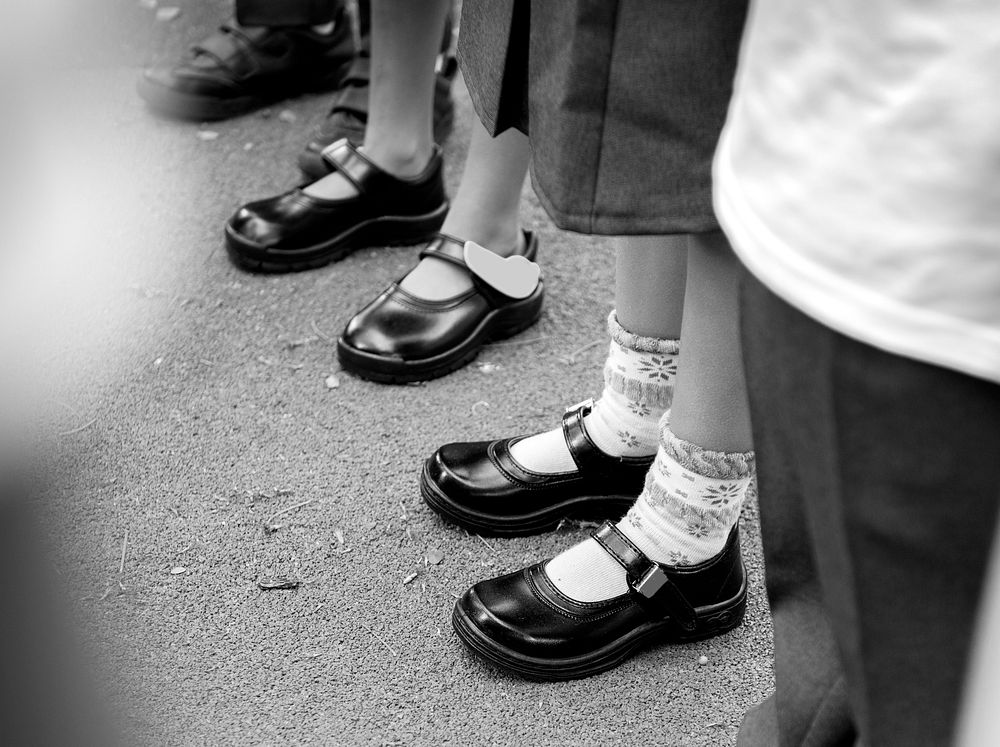 Kids in school uniform standing in line