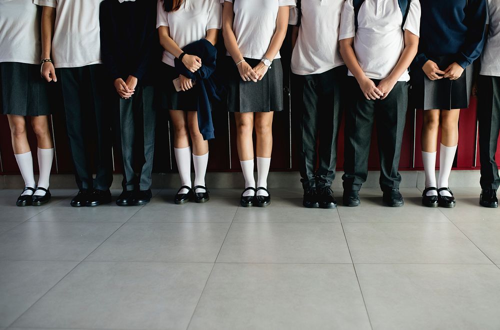 Group of students standing in the row