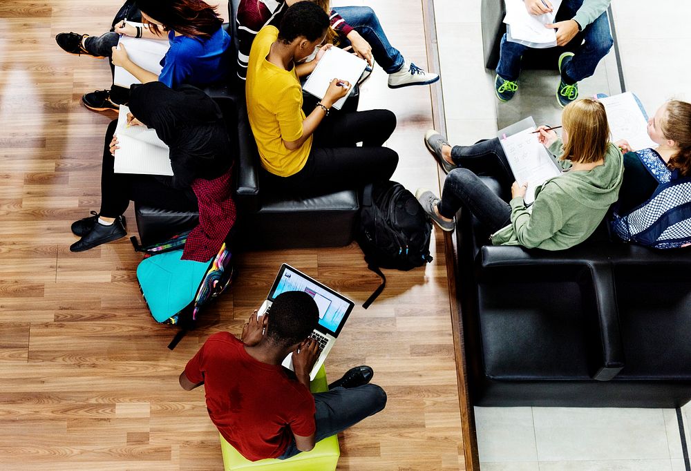 Students studying in a library environment 