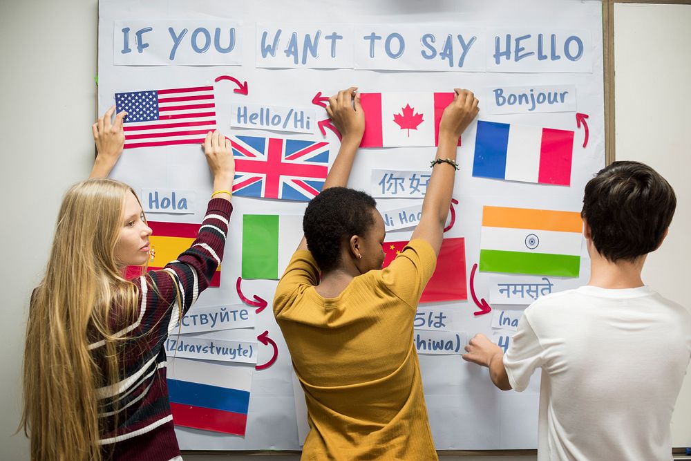 High school students working on international flags board