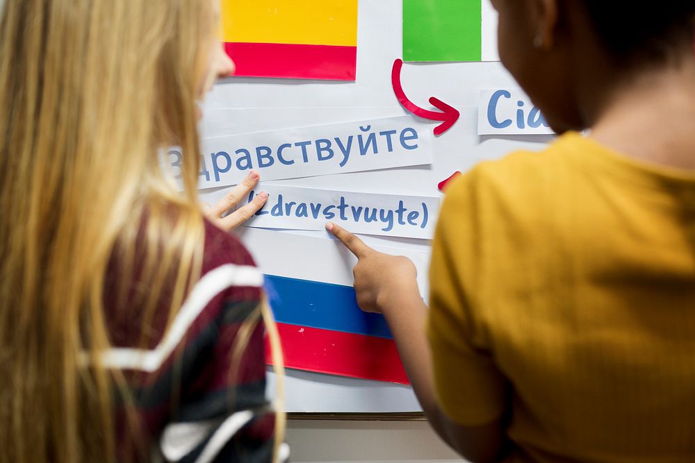 High school students working on international flags board