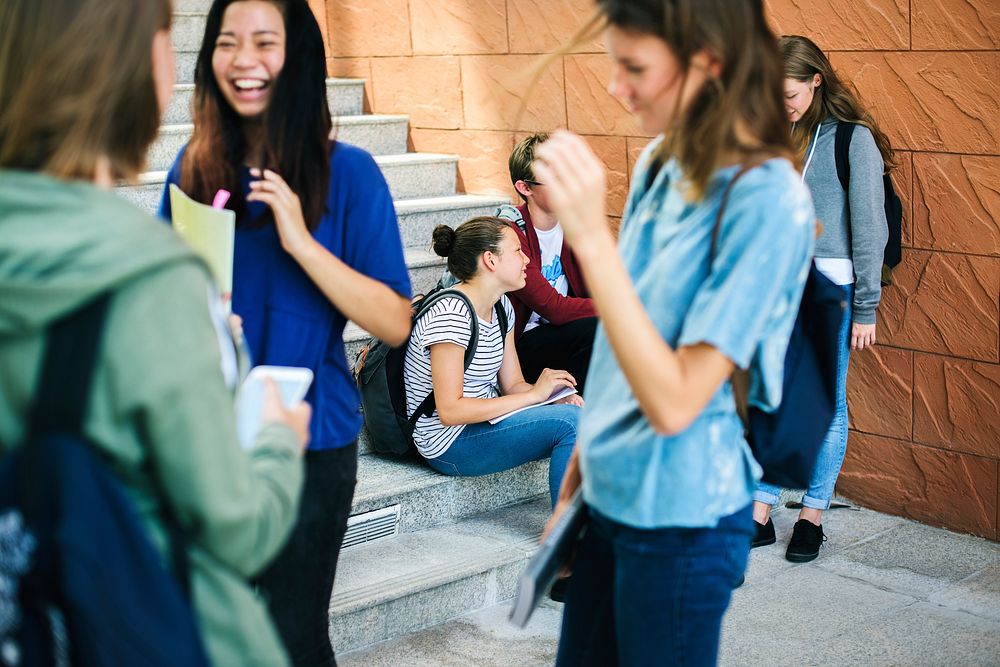 Group of students talking at the stairs