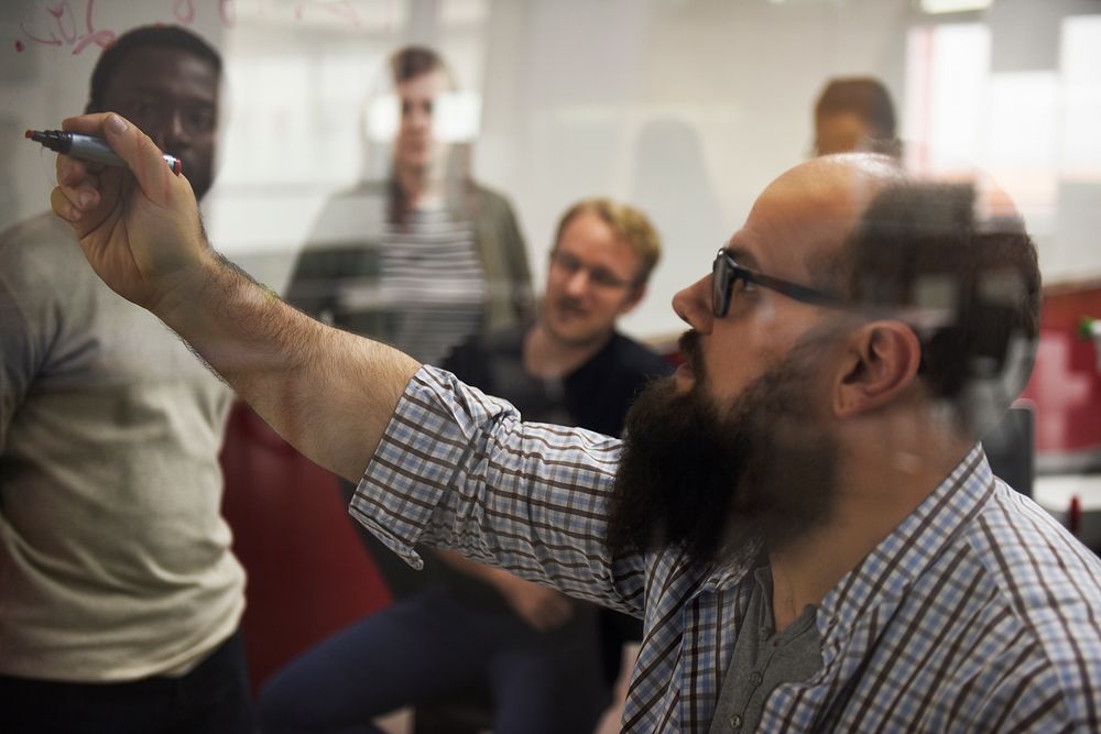 Group of diverse people attending startup business course
