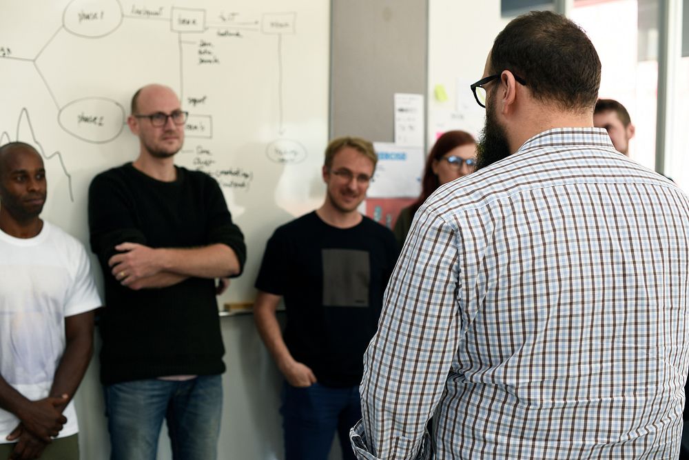 Group of diverse people attending startup business course