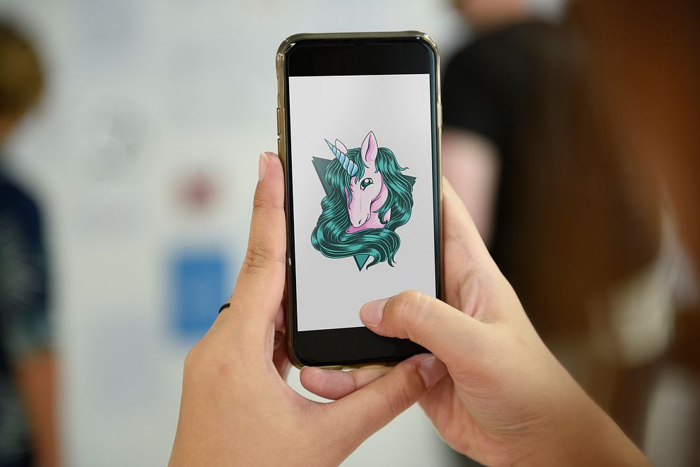 Mobile phone showing unicorn graphic