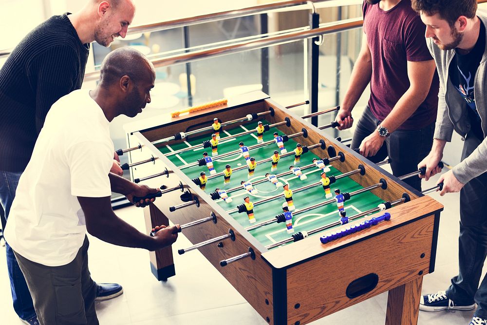 People Playing Enjoying Foosball Table Soccer Game Recreation Le