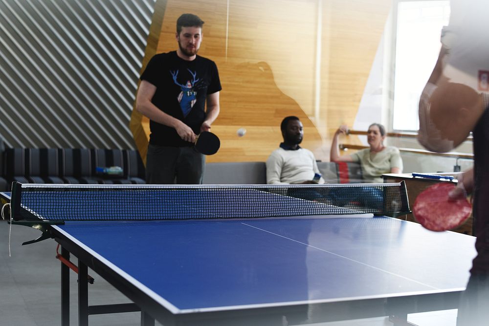Startup Business People Playing Table Tennis Together During Break Time
