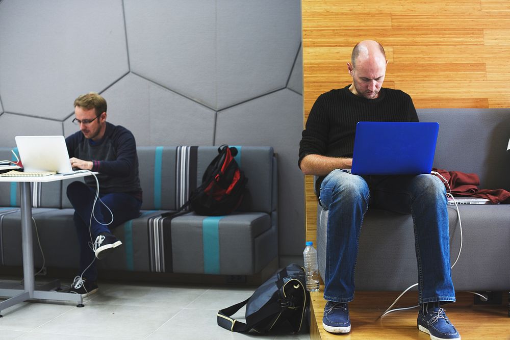 Caucasian men using computer laptop