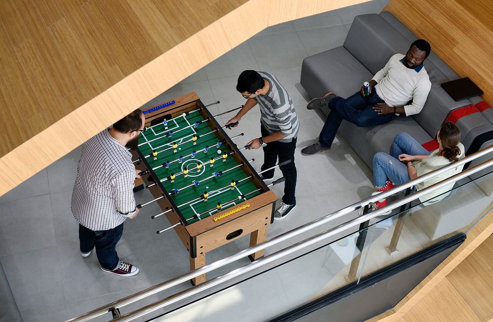 People Playing Enjoying Foosball Table Soccer Game Recreation Leisure