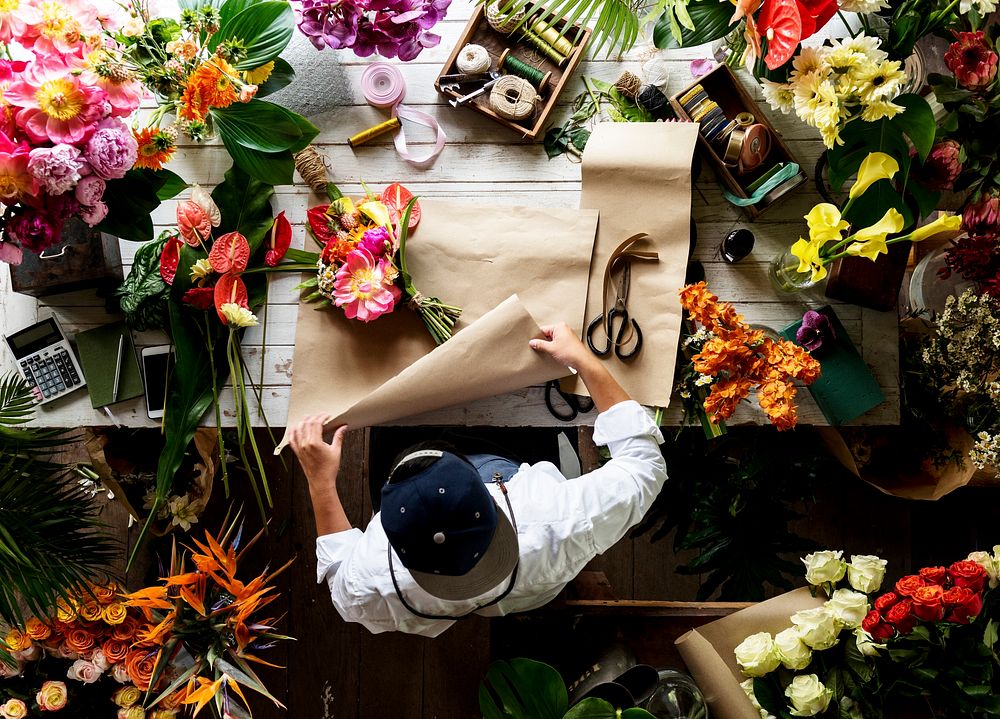 Florist making a flower arrangement in a flower shop