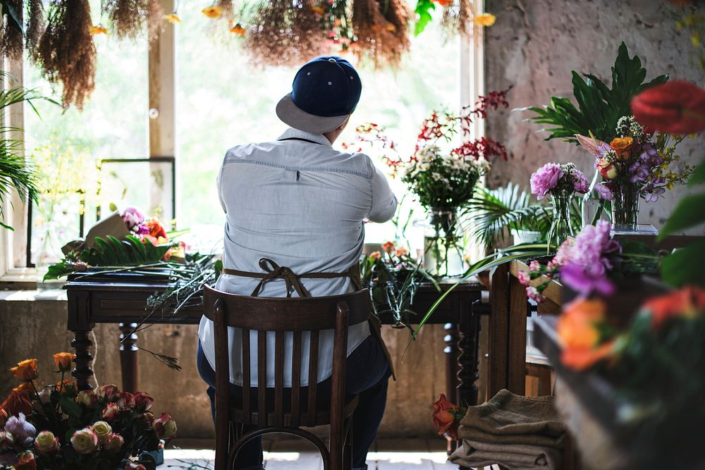 Flower shop business owner working service