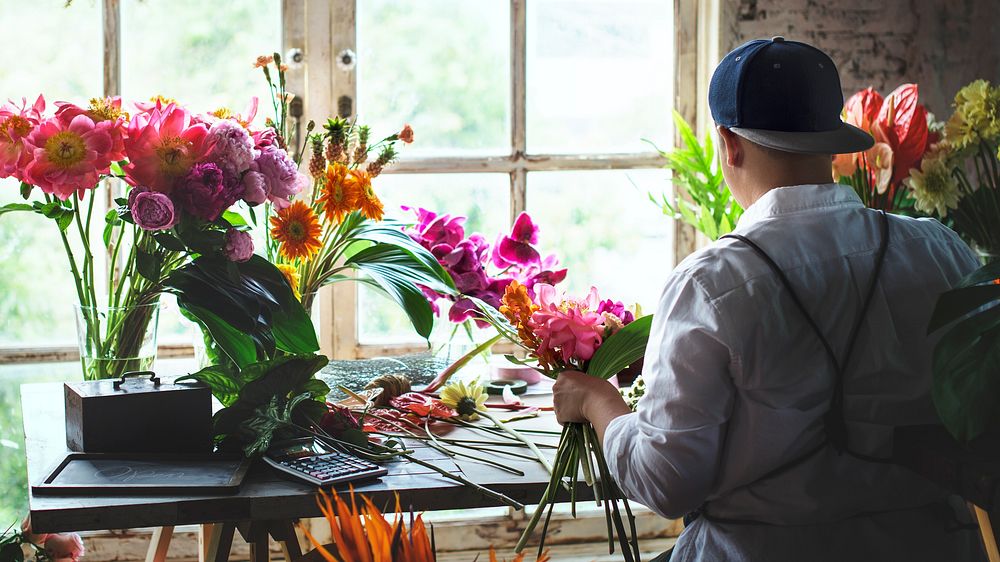 Florist working on the workspace in flower shop