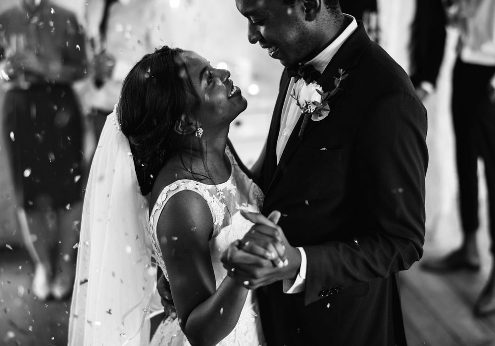 Black couple dancing on their wedding day