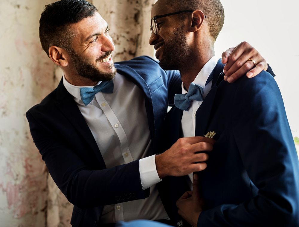 Gay Couple in Navy Blue Tuxedo Sitting Together