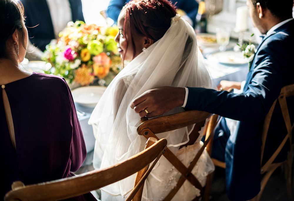 Groom Hand on Bride Chair Wedding Reception