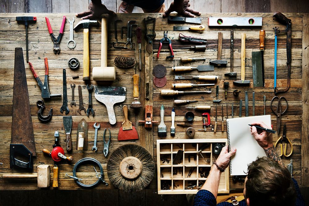 Aerial view of carpenter man with working tools equipment set