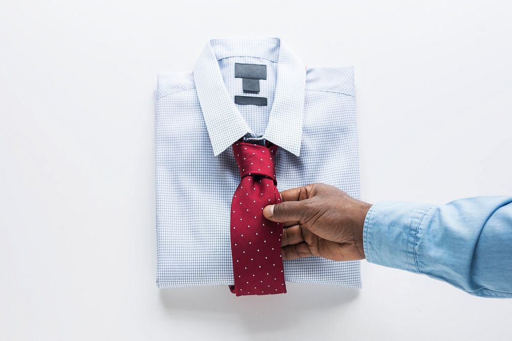 Folded men's shirt and tie