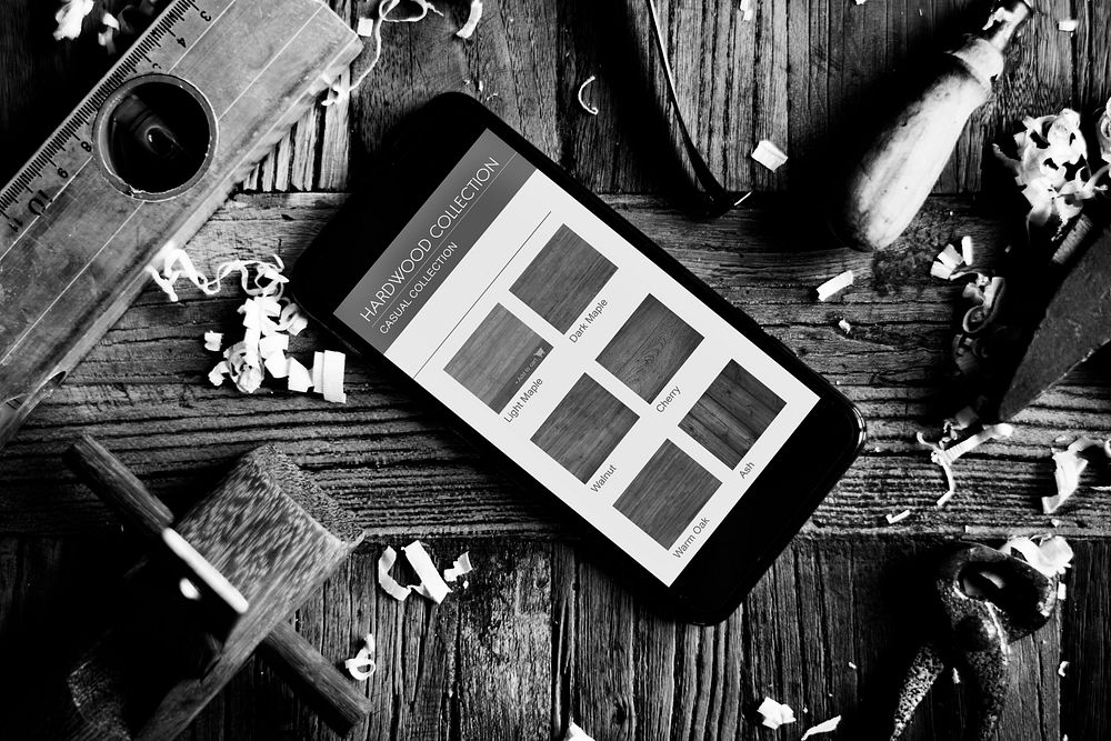 Aerial view of hardwood collection catalog on mobile phone screen grayscale