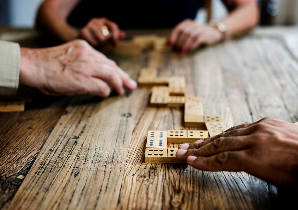 Group of people playing dominoes