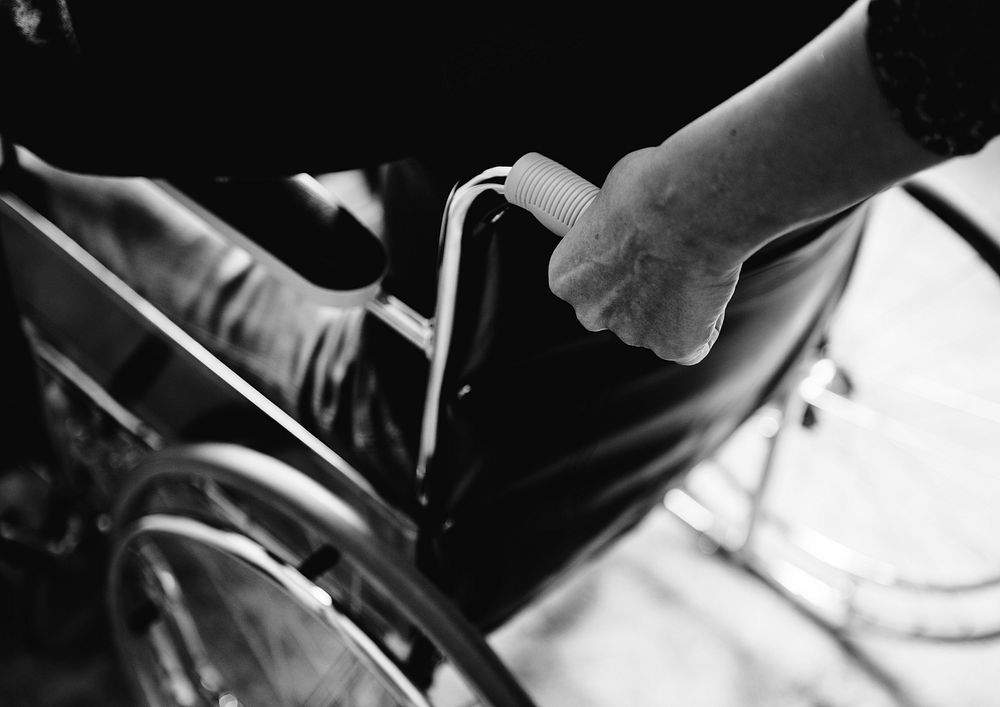 Closeup of hand on wheelchair 