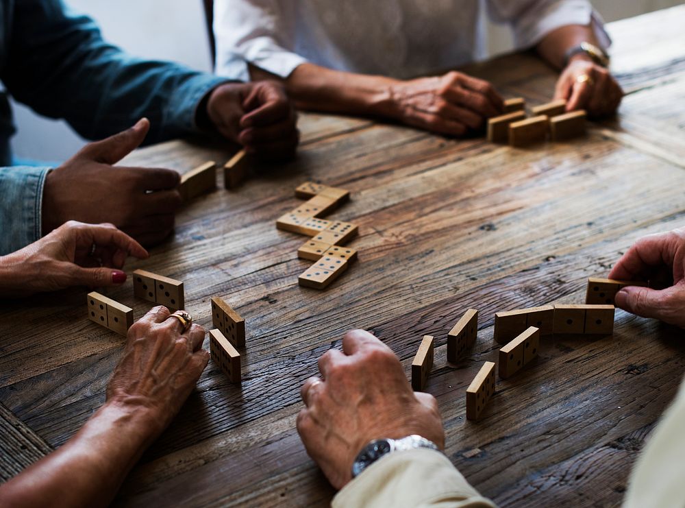 Group of people playing dominoes 