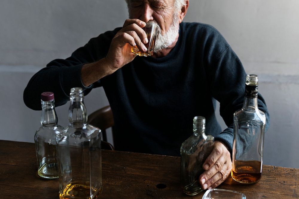 Elderly man drinking alcohol 