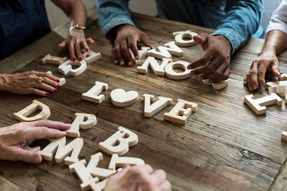 Diverse group spell out love
