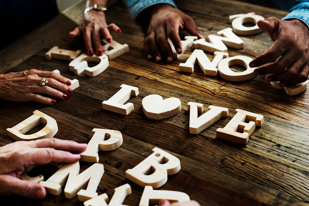Diverse hands spelling out love