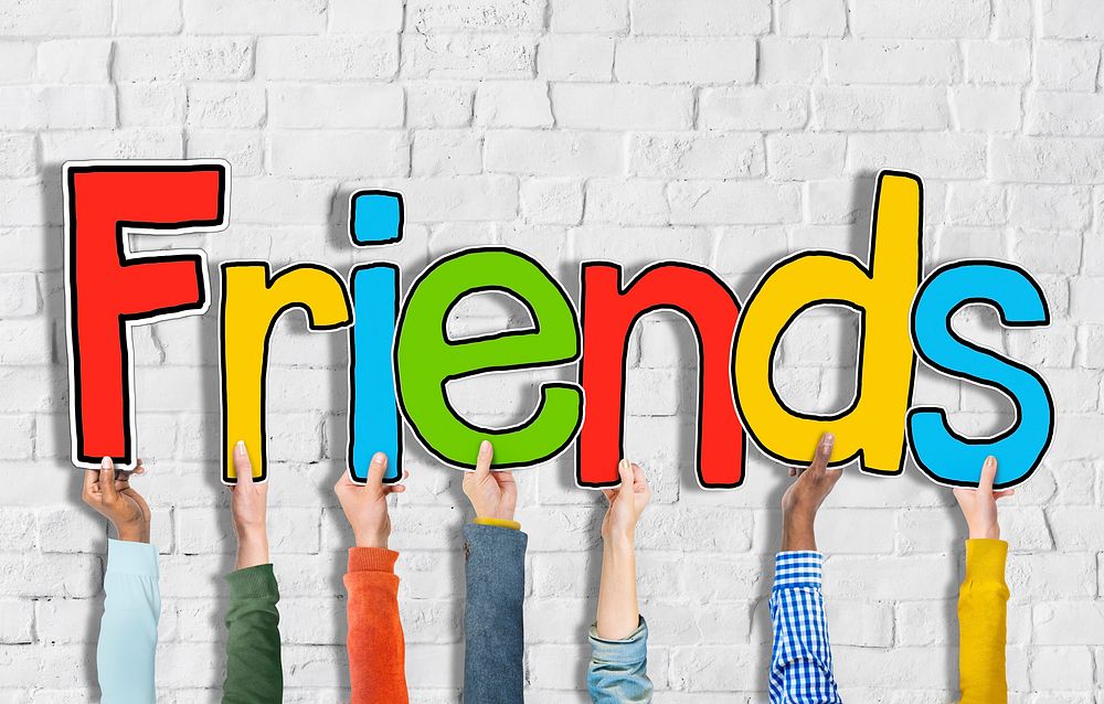 Multiethnic Group of Hands Holding Letter Friends