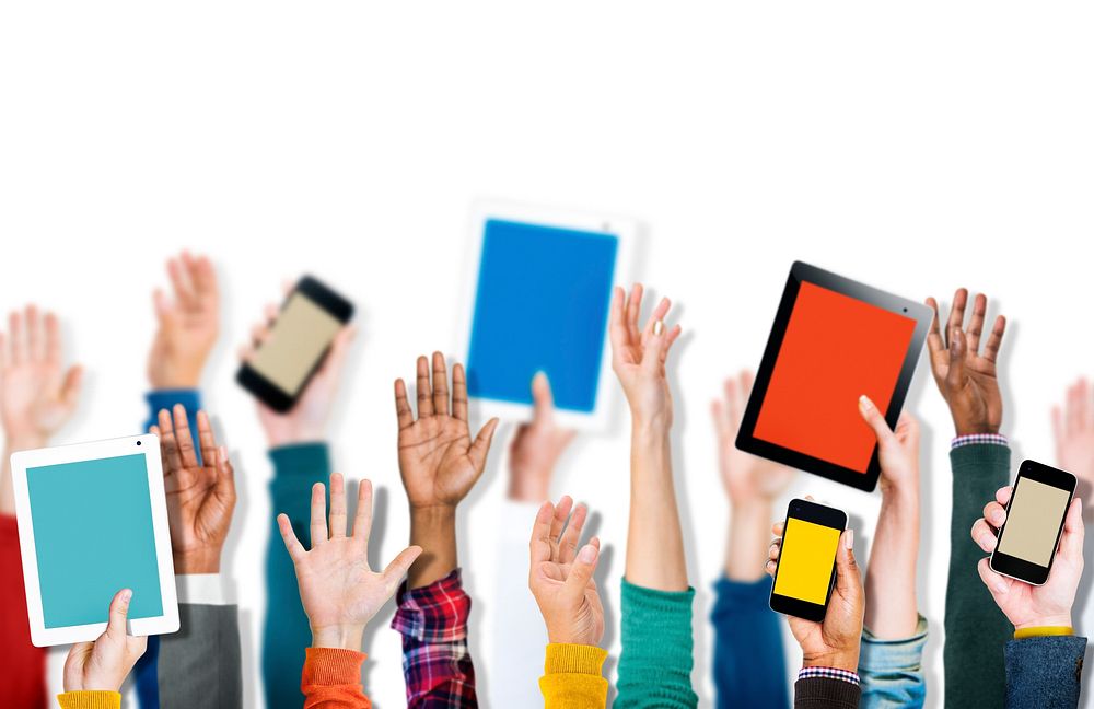 Group of Hands Holding Digital Devices Isolated on White