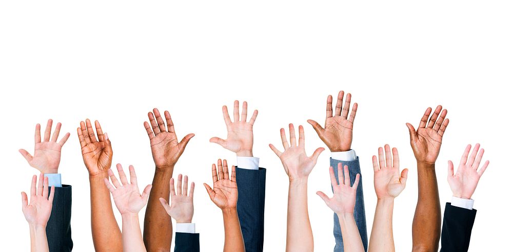 Diverse group of raised hands 