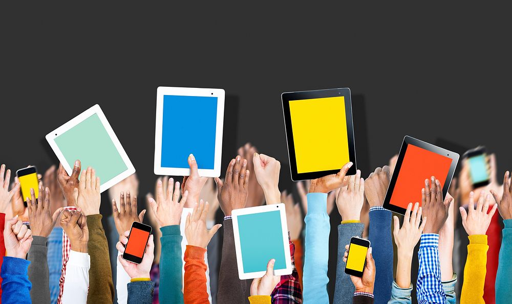 Group of Hands Holding Digital Devices with Copy Space