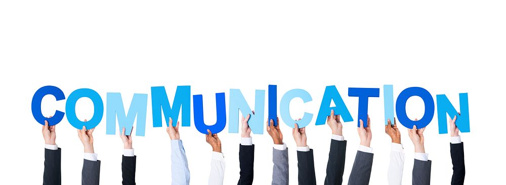 Business People Arms Raised and Holding the Word Communication