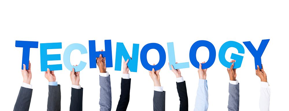 Business People Arms Raised and Holding the Word Technology