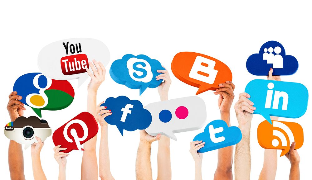 Hands Holding Speech Bubbles With Social Media Logos