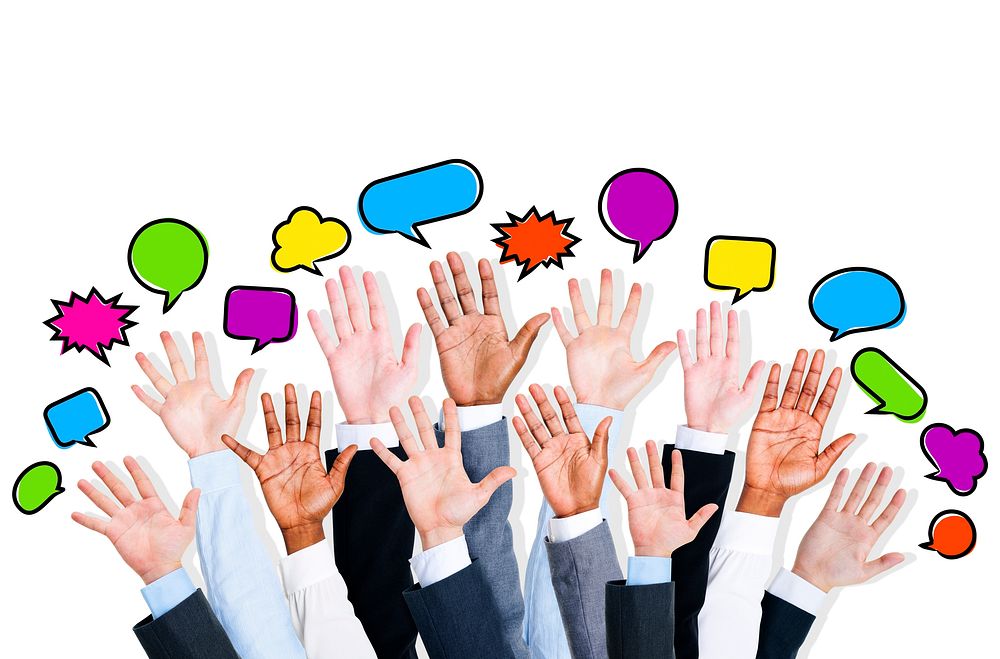 Business people's arms raised with speech bubble