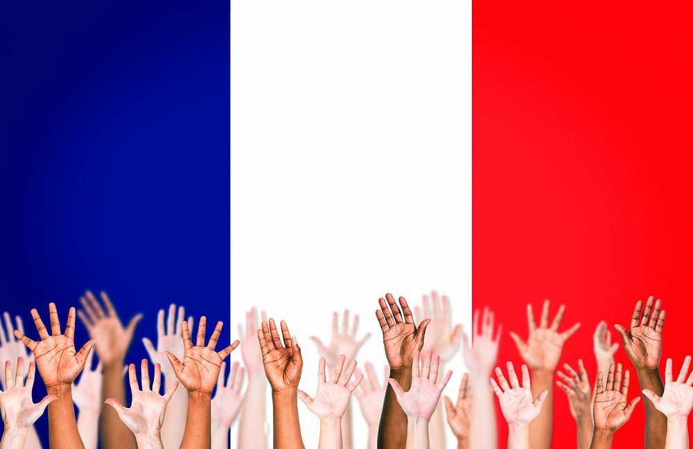 Multi-Ethnic Arms Outstretched With Flag Of France For The Background.