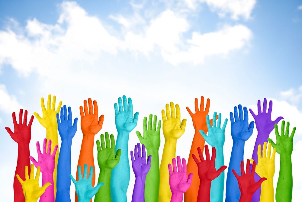 Colorful Hands Raised With Blue Sky