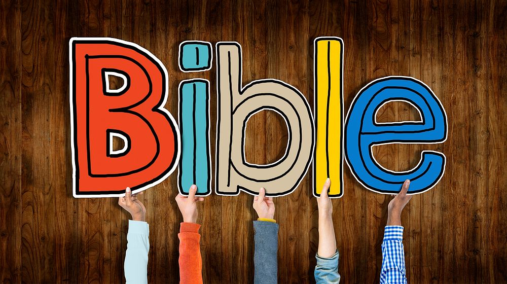 Group of Hands Holding Letter Bible