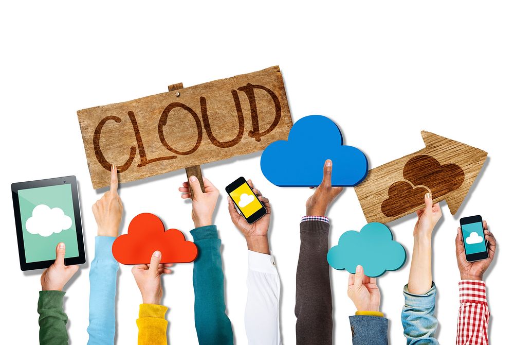 Group of Hands Holding Digital Devices with Cloud Concept