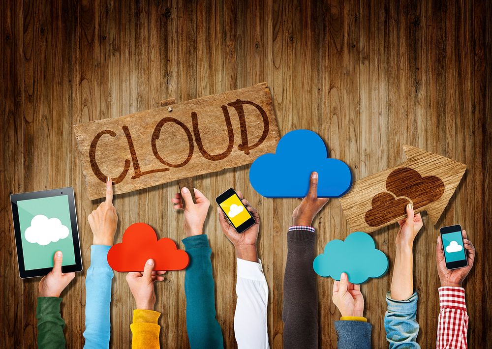 Group of Hands Holding Cloud Computing Digital Devices