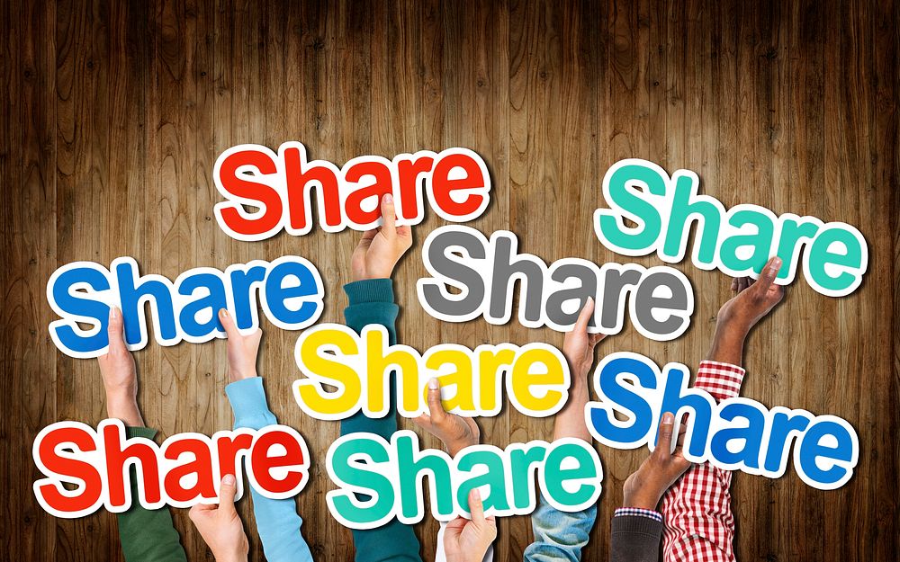 Group of Hands Holding the Word Share